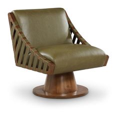 a green leather chair with wooden legs on a white background, it appears to be in the style of art deco