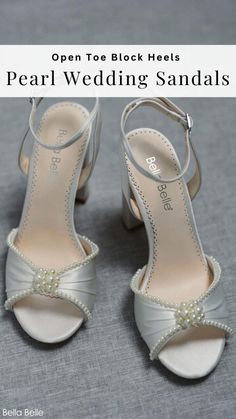 a pair of white shoes with pearls on the toes and heel are shown in front of a