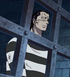 a man in jail looking out from behind bars