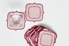 pink placemats and plates on white surface