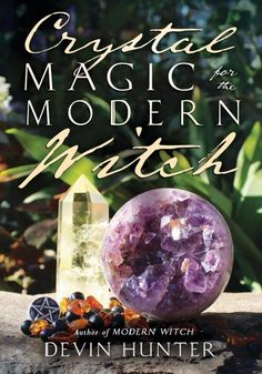 the cover of crystal magic for the modern witch by devin hunter, featuring an amethorate and crystals