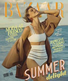 a woman in a bathing suit on the cover of bazaar magazine, with her arms behind her head