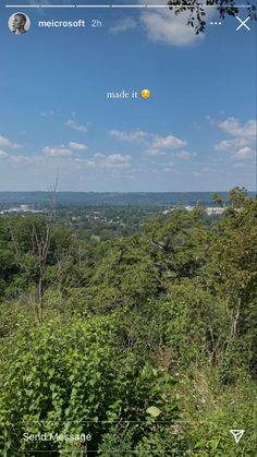 an image of the sky and trees taken from a hill top on a cell phone