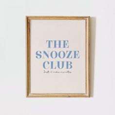 the snooze club poster hanging on a wall