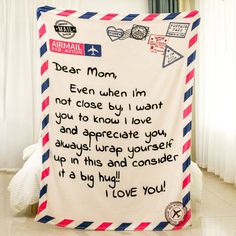 an airmail themed blanket with the words dear mom, even when i'm not close by i want you to appreciate you