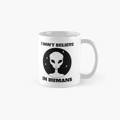 an alien mug that says i don't believe in humans