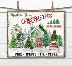 a christmas tree farm sign hanging on a clothes line with pine trees and a red fire hydrant