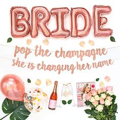 there is a sign that says bride pop the champagne she's changing her name