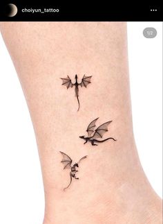 two small dragon tattoos on the ankle