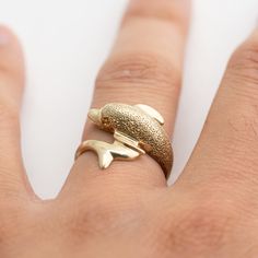 Hi. This is a very nice dolphin gold ring 14k yellow gold. It is marked 14k on the inside of the ring. The ring finger size is 7. Sorry, we do not resize rings. The gold ring weighs 4.3 grams. The top of the dolphin has some specular highlights. It's nice. Thank you very much for looking. Vintage Gold Ring, Dolphin Ring, Vintage Gold Rings, Resize Ring, Ocean Inspired, Ocean Inspiration, Ring Finger, Ring Ring, Ring Size 7