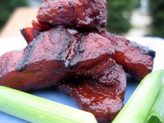 some meat and celery on a blue plate