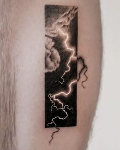 a black and white photo of a lightning storm on the back of a man's arm