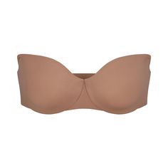 This sleek, supportive strapless bra is a double layered solution with comfortable hidden cushion underwire and ultra-wide wings that perfectly smooth your back and sides. Features silicone tape along the neckline and wing to keep it in place all day long, smoothing adjustable straps, and a hook and eye back closure. Fits true to size. | SKIMS Smoothing Strapless Bra | Medium Neutral | 32C | Smoothing Intimates Seamless Strapless Bra, Silicone Tape, Most Comfortable Bra, Wireless Bras, High Waisted Briefs, Bra Cup Sizes, Mesh Bra, Cotton Bras, Bandeau Bra