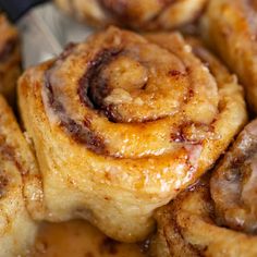 cinnamon rolls are piled on top of each other