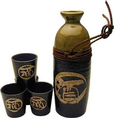 a set of four shot glasses sitting next to a vase with rope wrapped around it