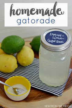 homemade gatorade with lemons and limes on a cutting board next to a jar