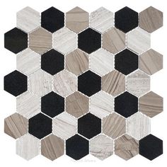 a white and black mosaic tile with hexagons on the bottom, in different colors