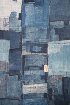 an abstract piece of cloth with blue and white squares on it's sides,