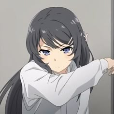 an anime character with long black hair and blue eyes pointing to the side while standing in front of a door