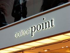 a store front with the word collect point lit up