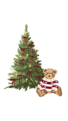 a teddy bear sitting next to a christmas tree