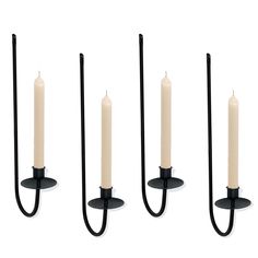 four candles are shown in three different positions