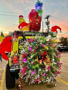 a jeep decorated with christmas decorations in the parking lot