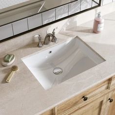 a bathroom sink sitting on top of a counter