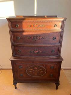 an old wooden dresser sitting on top of a floor