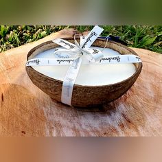 a coconut bowl wrapped in white paper and tied with a ribbon