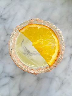 an overhead view of a drink with orange slices