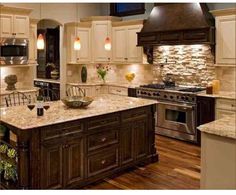 a large kitchen with an island in the middle and lots of cabinets on both sides