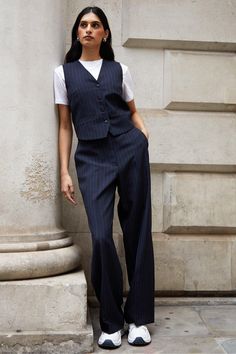 Elevate your style with this fitted waistcoat from Threadbare, perfect to hit the soft tailoring trend. With a v-neck opening and button fastening, add a sophisticated modern edge to any outfit whether you wear it as a standalone statement piece or as a layer over t-shirts or dresses. Matching trousers are also available to wear as a co-ord. Model wears UK size 8. Fitted Waistcoat Women, Open Waistcoat Outfit, V Neck Vest Outfits For Women, Off White Shirt Women Outfit, Style A Waistcoat Women, Trouser Vest Outfit, Woman’s Vest Outfit, Shirt And Waistcoat Outfit, Trouser And Vest Outfit