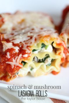 spinach and mushroom lasagna rolls on a white plate with the title above it