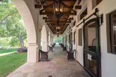 the walkway is lined with chairs and windows