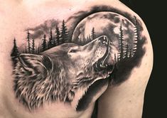 a man's chest with a wolf and moon tattoo design on it, in black and white