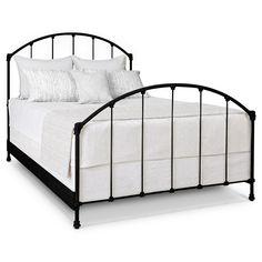 a black metal bed frame with white linens and pillows on the headboard, against a white background