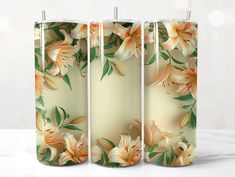 three vases with flowers painted on them sitting next to each other in front of a white background