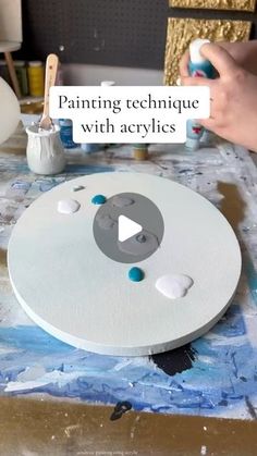 someone is painting an art project with acrylics