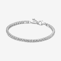 Tennis bracelets, anyone? This sterling silver Sparkling Tennis Bracelet features squared collets and is decorated with a bold line of clear cubic zirconia to make a statement fit for any occasion. Wear it on its own or stack bracelets of different colors and metal finishes for a modern look. - Pandora Sparkling Tennis Bracelet - Sterling silver / Cubic Zirconia / Clear - Sz. 7.9 in Classic Silver Sparkling Diamond Bracelet, Classic Sterling Silver Bracelet With Sparkling Stones, Classic Silver Tennis Bracelet With Sparkling Details, Classic Silver Sparkling Tennis Bracelet, Timeless Silver Jewelry With Rhinestones, Timeless Silver Sparkling Jewelry, Timeless Sparkling Silver Jewelry, Modern Silver Bracelets With Sparkling Stones, Classic Formal Bracelets With Rhinestones