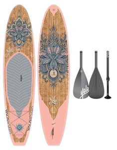 two paddle boards, one with an ornate design and the other with decorative designs on it