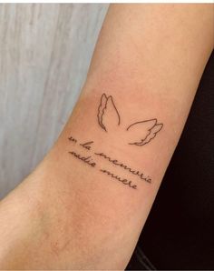 a woman's arm with a tattoo that reads, i am an american eagle and two doves