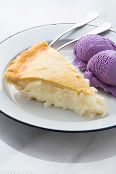 there is a piece of pie and ice cream on the plate next to each other