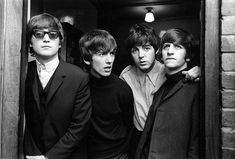 black and white photograph of the beatles