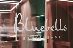 bluebells restaurant logo on the glass door