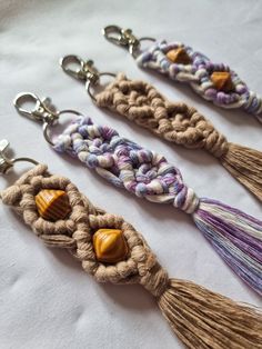 three tasseled key chains with wooden beads