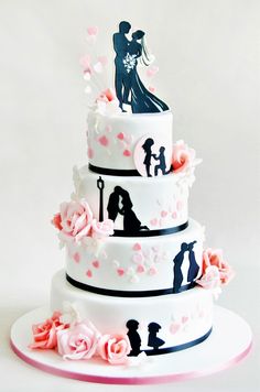 a wedding cake decorated with silhouettes and flowers