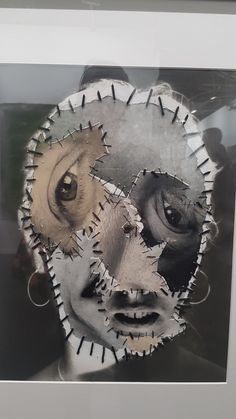 an altered photograph of a woman's face with gears in the shape of her eyes