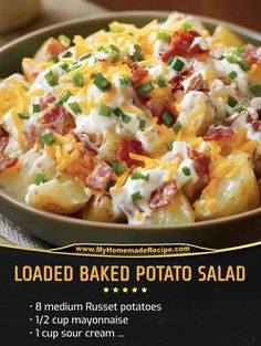 loaded baked potato salad with bacon, cheese and green onions in a bowl on a table