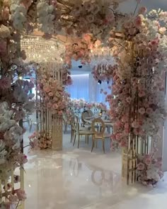 an elegant wedding setup with flowers and chandeliers